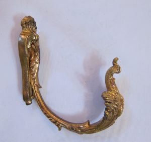 Two pairs of gilt tie backs