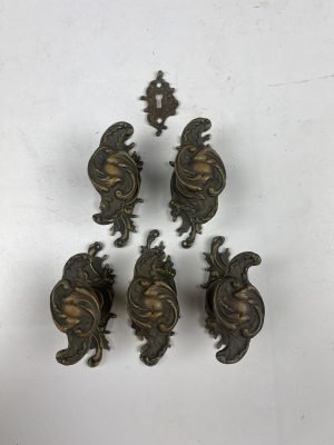 Set of five brass door knobs